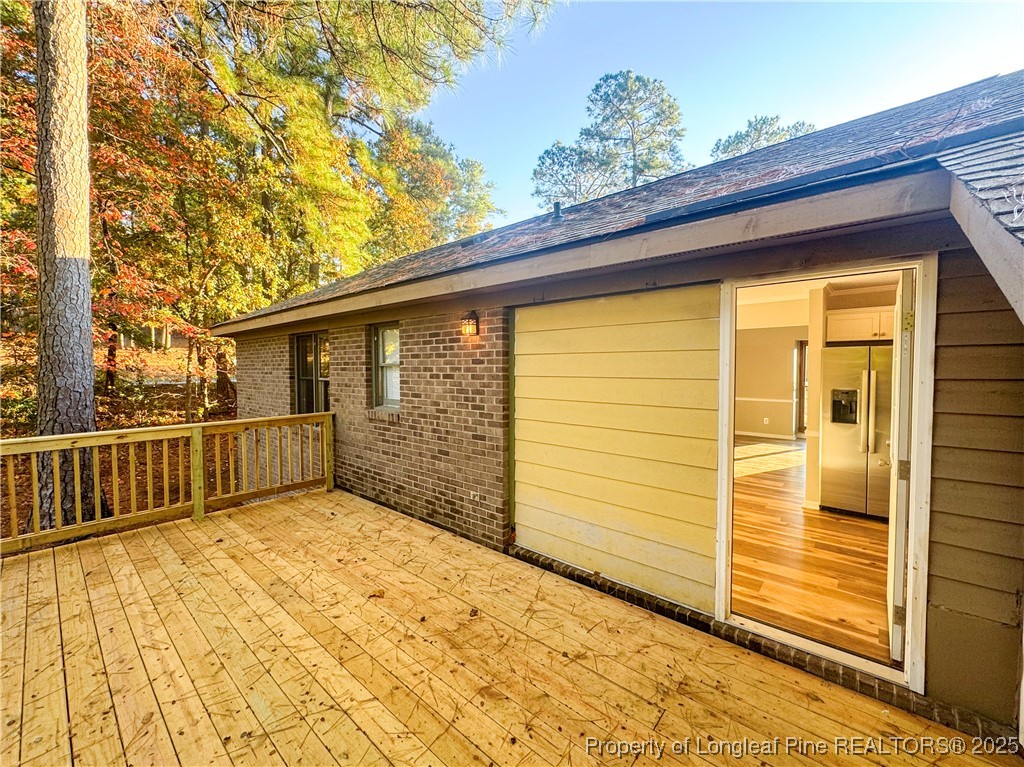 527 Coronation Drive Fayetteville, NC 28311 - Photo 16 of 16 a view of a house with a wooden wall