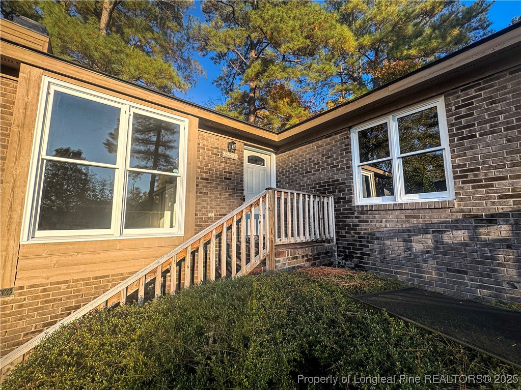 527 Coronation Drive Fayetteville, NC 28311 - Photo 2 of 16 a view of a house with a small yard and wooden floor and fence