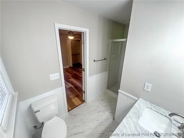 a bathroom with a toilet and a sink