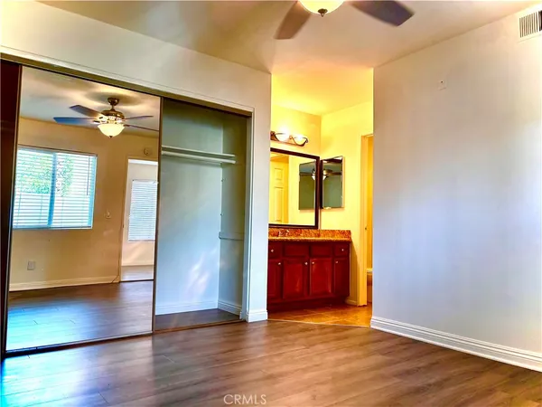 a view of an empty room and wooden floor
