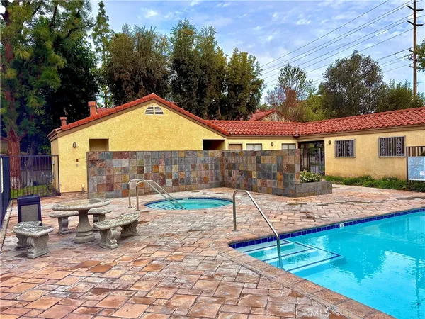 a view of a backyard with sitting area