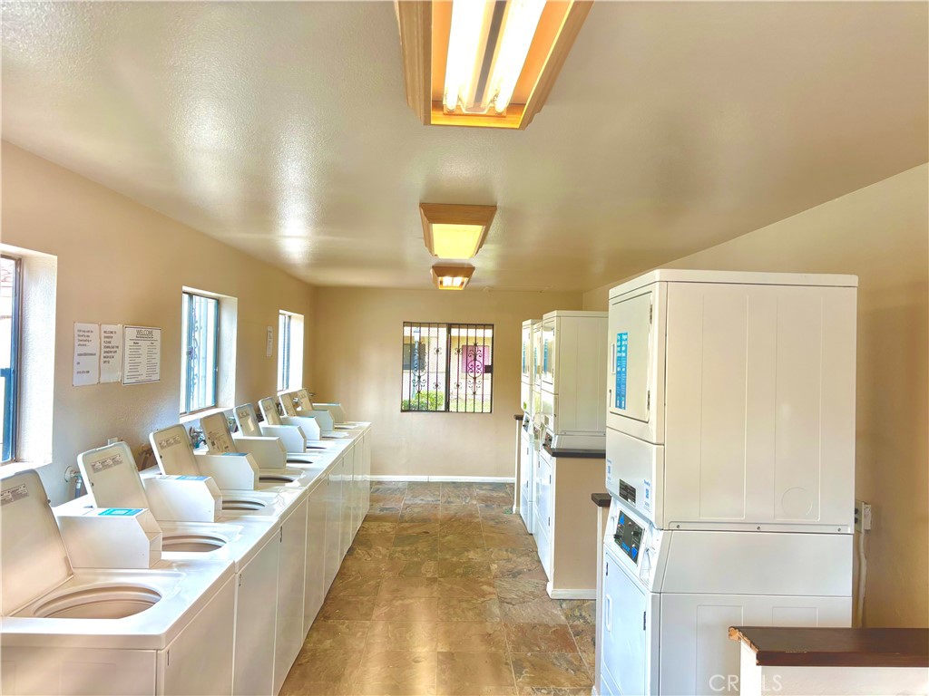 1110 West Blaine Street, Unit 102 Riverside, CA 92507 - Photo 22 of 23 a living room with furniture and a table