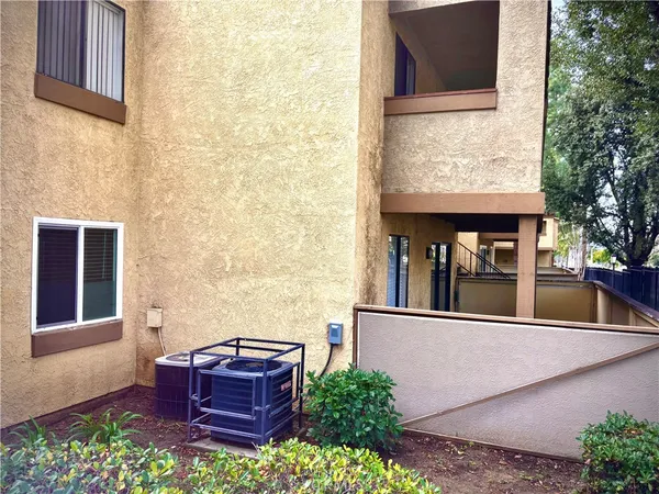 a view of balcony with furniture