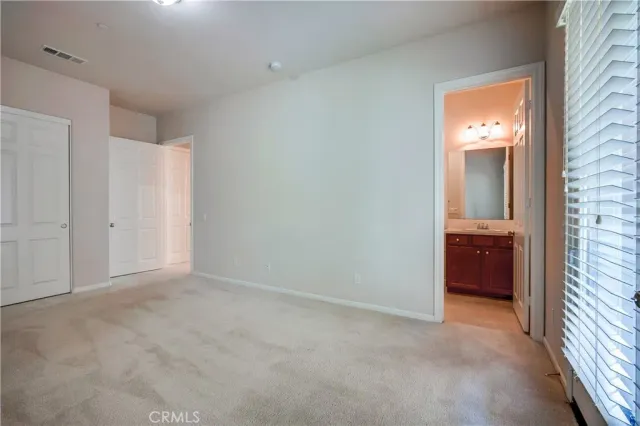 a bathroom with a sink double vanity and a mirror