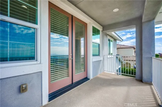 an empty room with a empty space and windows