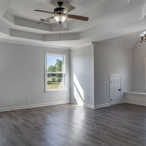 296 Rock Bridge Road Gallatin, TN 37066 - Photo 13 of 45 a view of an empty room with wooden floor and a window
