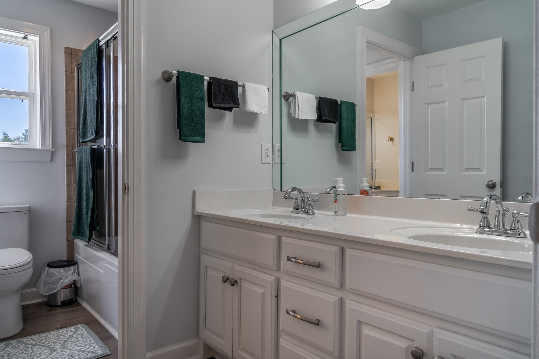 296 Rock Bridge Road Gallatin, TN 37066 - Photo 28 of 45 a bathroom with a double vanity sink and mirror