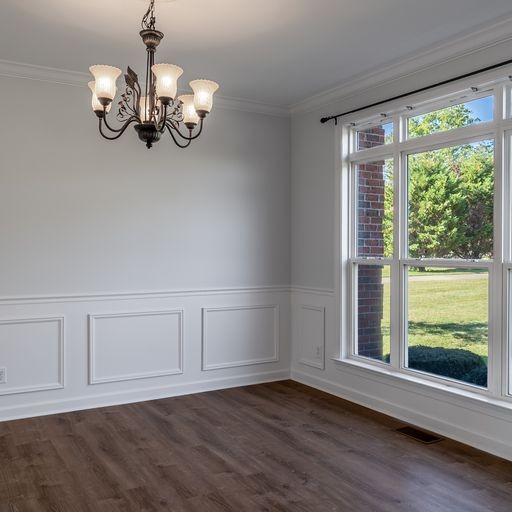 296 Rock Bridge Road Gallatin, TN 37066 - Photo 3 of 45 a view of an empty room with wooden floor and a window