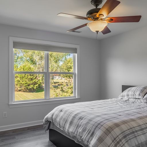 296 Rock Bridge Road Gallatin, TN 37066 - Photo 31 of 45 a bedroom with a large bed and a window