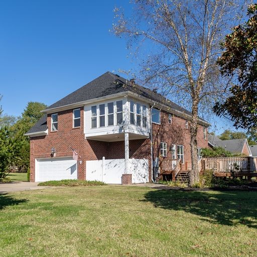 296 Rock Bridge Road Gallatin, TN 37066 - Photo 39 of 45 a front view of a house with a garden