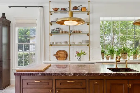 a kitchen with a stove and a window