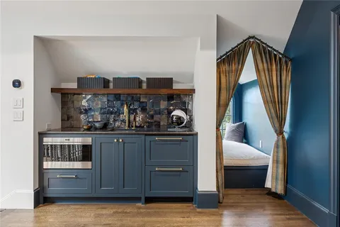 a kitchen with stainless steel appliances granite countertop a sink and cabinets