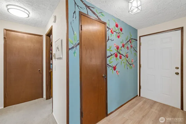 a view of hallway with closet area