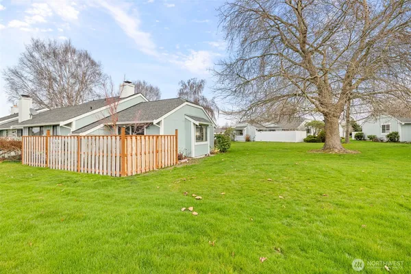a view of a house with a big yard