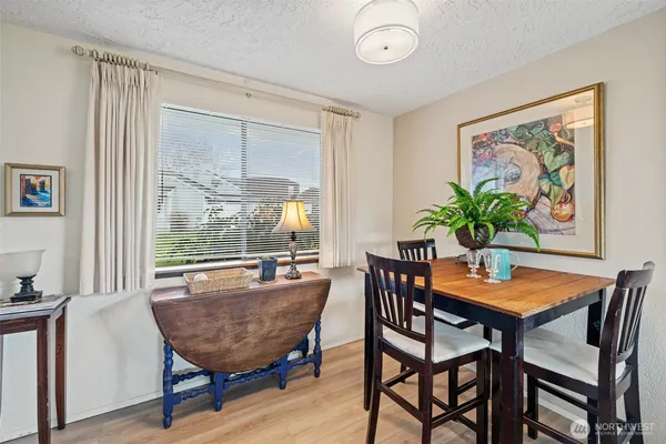 a dining room with furniture and window