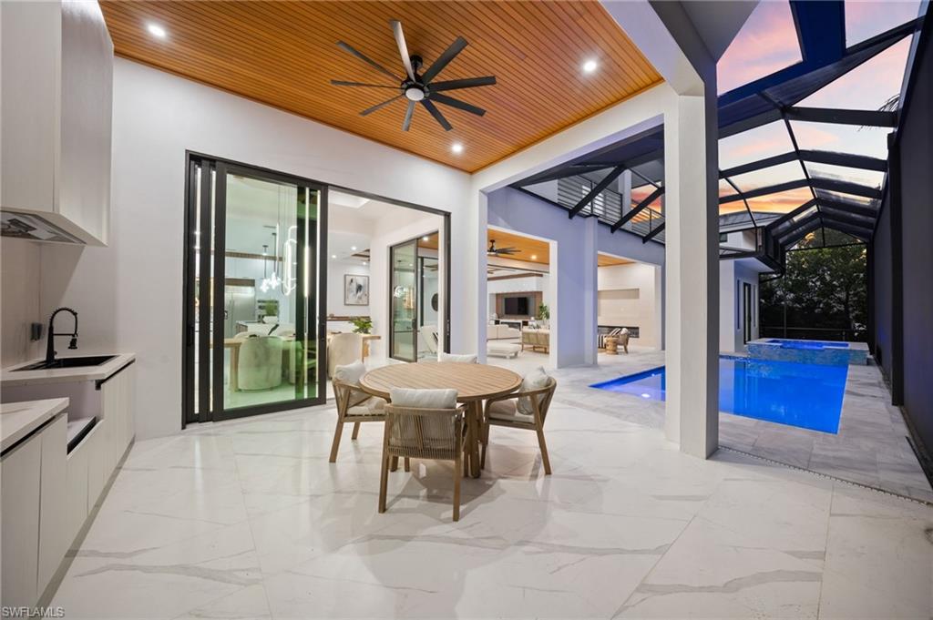 135 7th Street North Naples, FL 34102 - Photo 5 of 50 Enjoy highly coveted Western exposure for breathtaking sunsets, abundant natural light, and optimal sun over the pool.