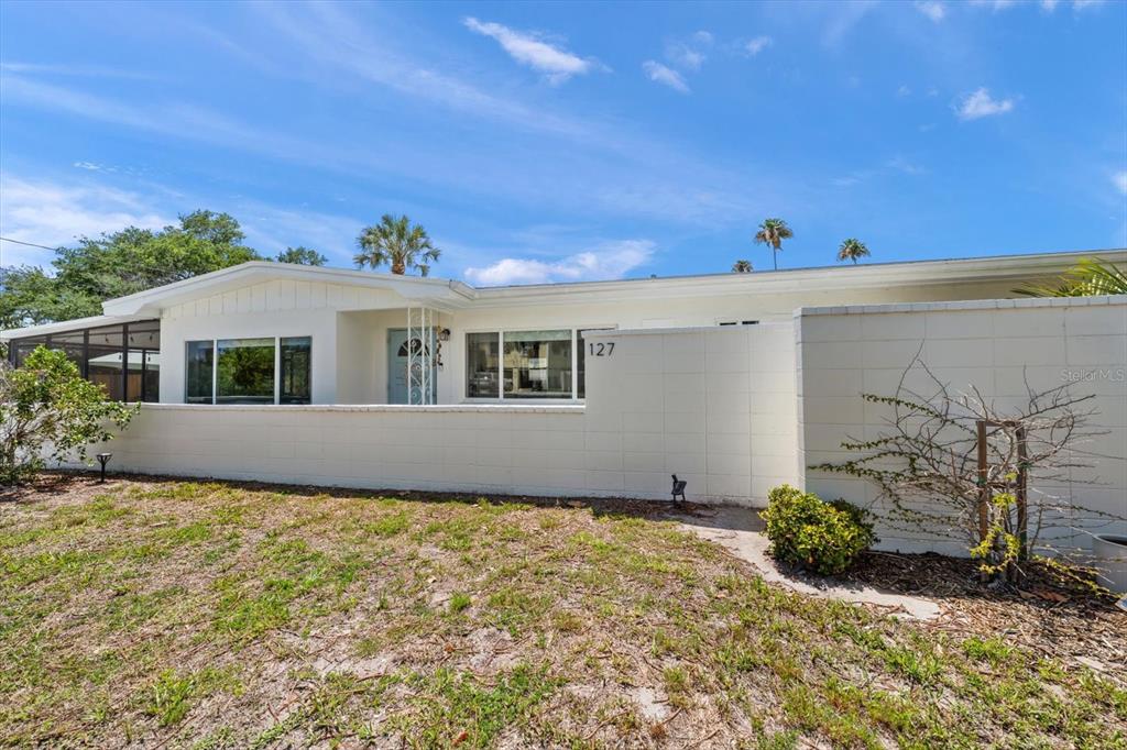 127 11th Avenue Indian Rocks Beach, FL 33785 - Photo 32 of 63 a view of front of house with potted plants