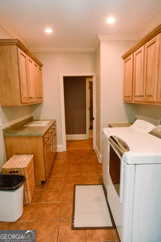 a kitchen that has a sink and a stove