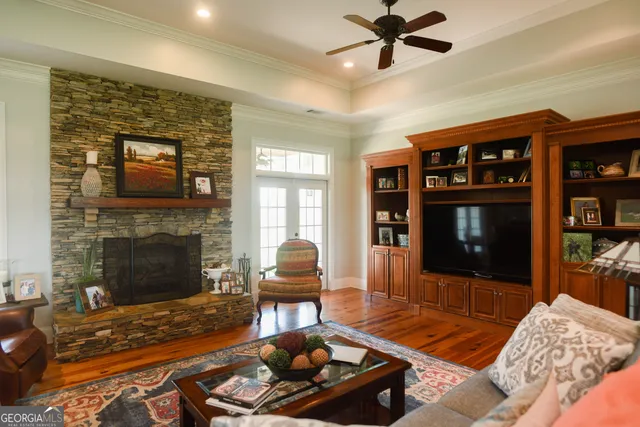 a living room with furniture and a fireplace