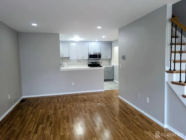 a view of a kitchen with a sink and a window
