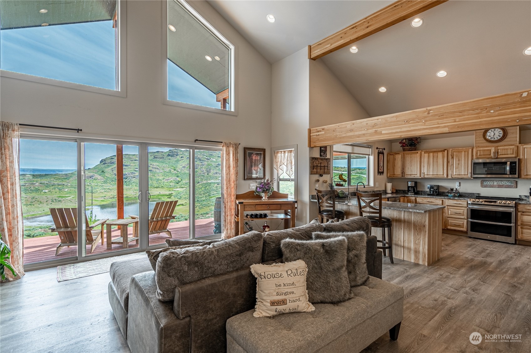 471 A Plata Road Brewster, WA 98812 - Photo 12 of 36 a living room with furniture kitchen area and large windows
