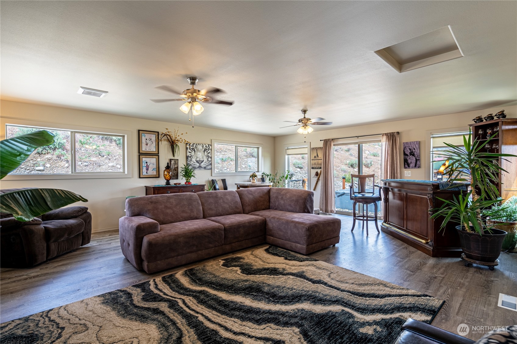 471 A Plata Road Brewster, WA 98812 - Photo 15 of 36 a living room with furniture ceiling fan and a rug