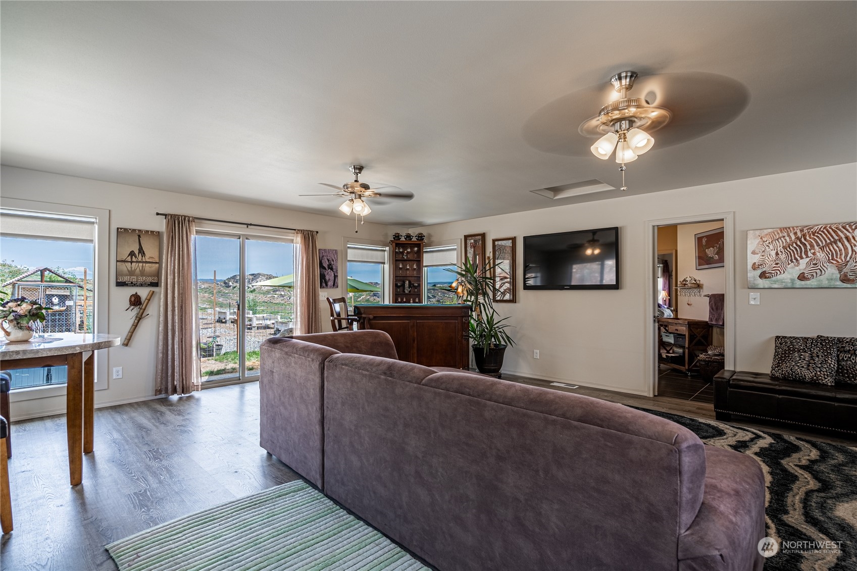 471 A Plata Road Brewster, WA 98812 - Photo 16 of 36 a living room with furniture and a flat screen tv
