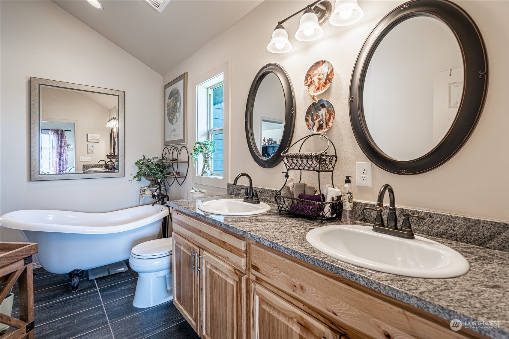 471 A Plata Road Brewster, WA 98812 - Photo 17 of 36 a bathroom with a granite countertop toilet a sink and a mirror