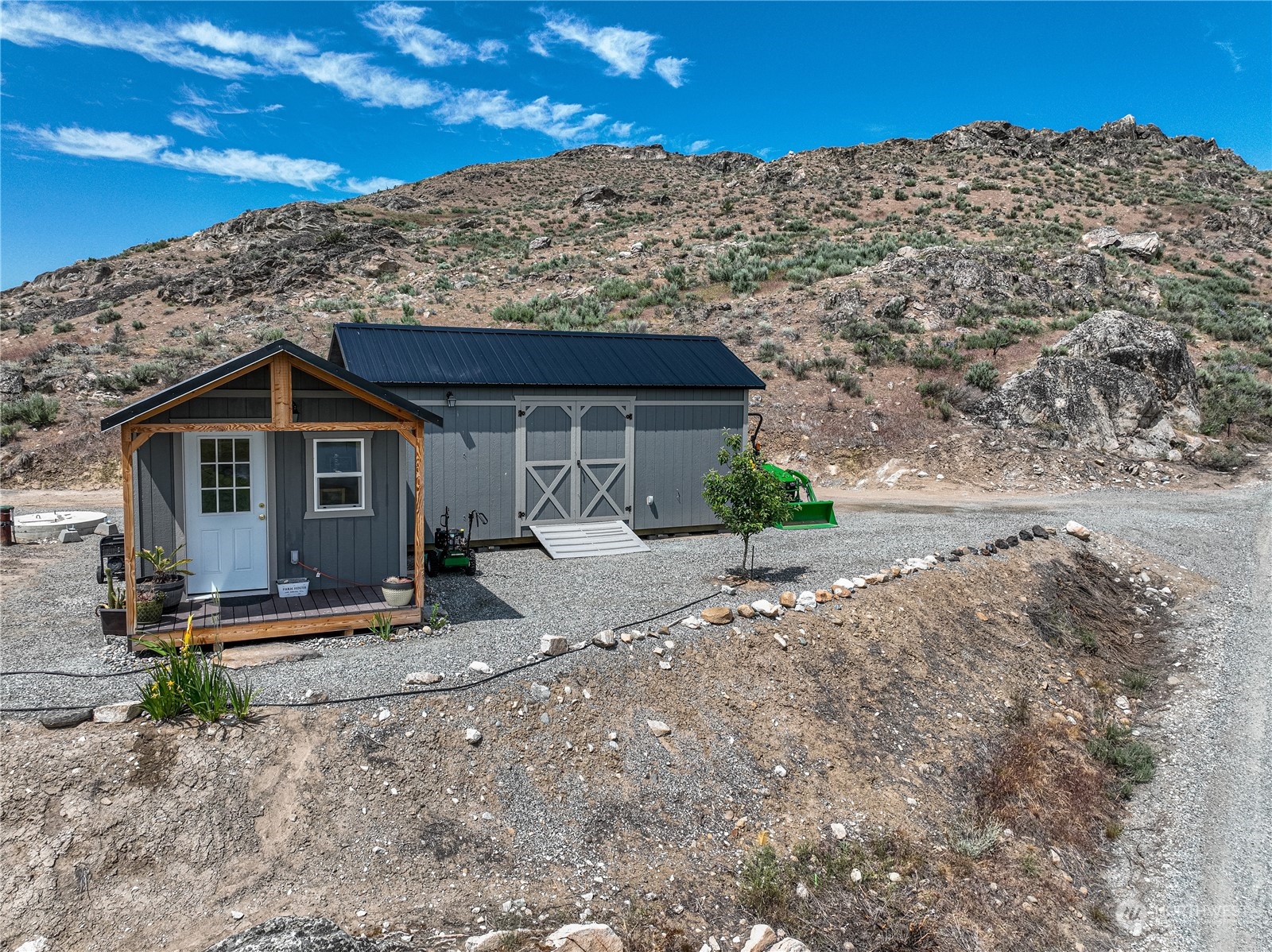 471 A Plata Road Brewster, WA 98812 - Photo 2 of 36 a front view of a house with a yard