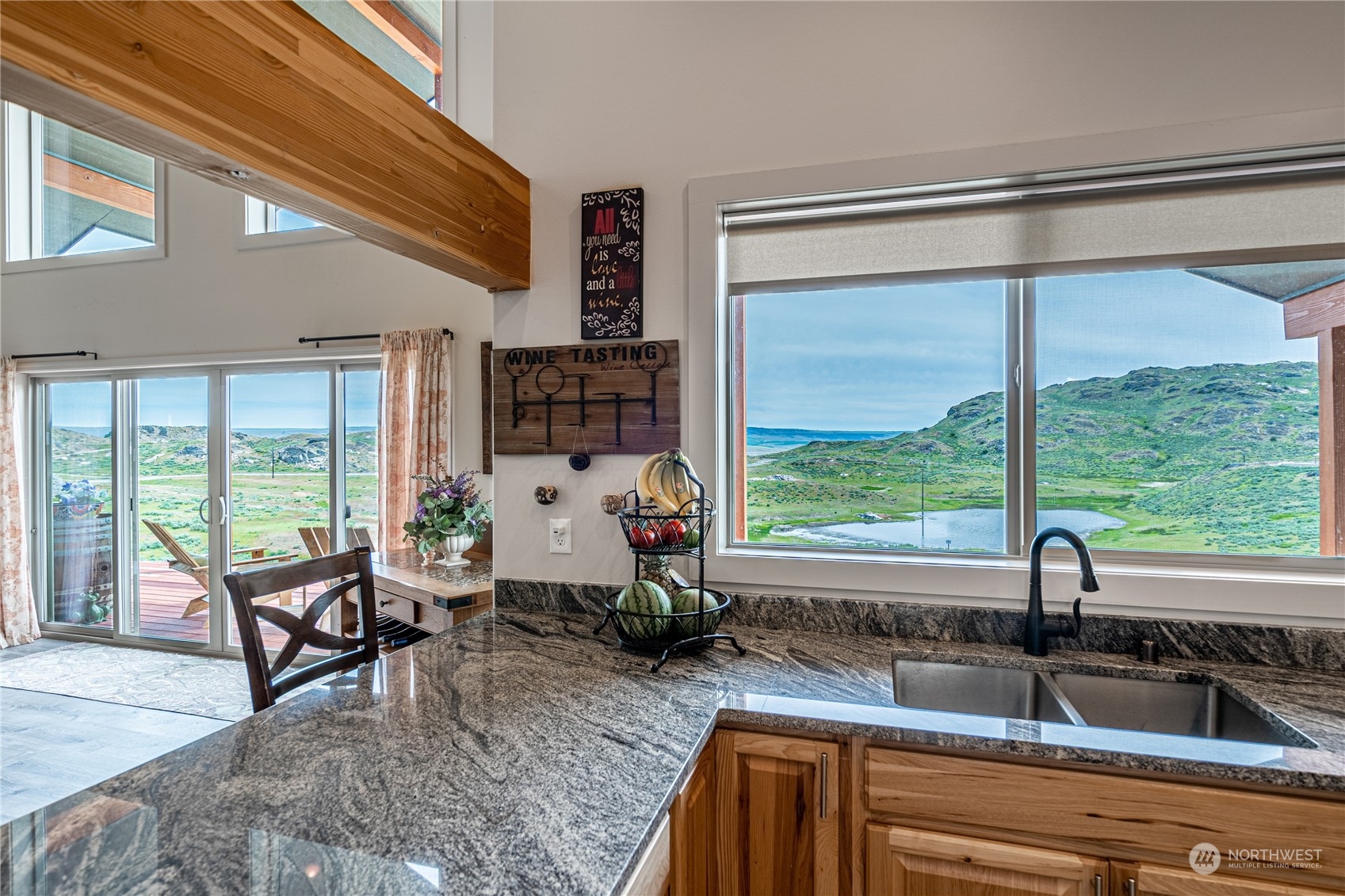 471 A Plata Road Brewster, WA 98812 - Photo 21 of 36 a living room with furniture and floor to ceiling windows