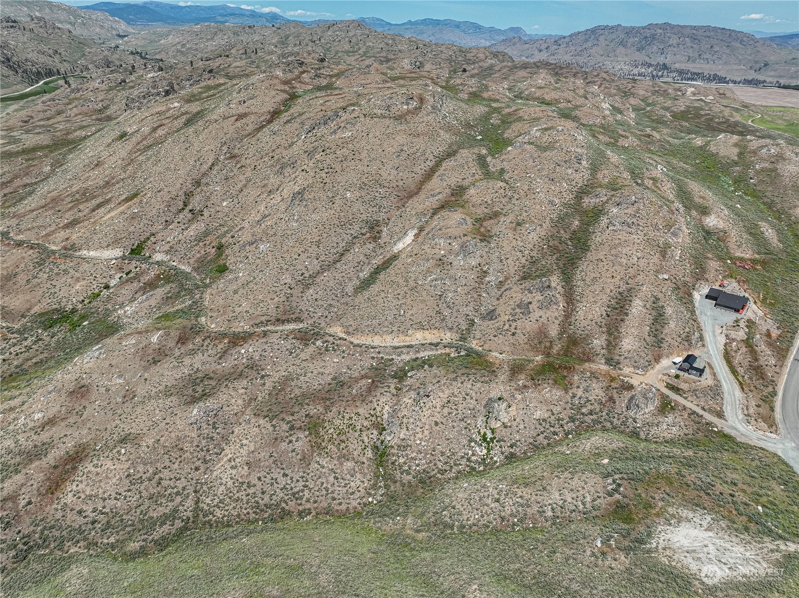 471 A Plata Road Brewster, WA 98812 - Photo 22 of 36 a view of a dry yard with wooden fence