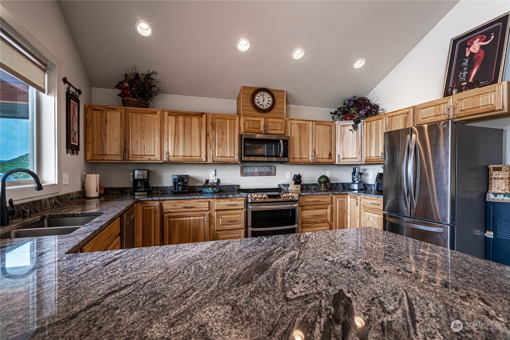 471 A Plata Road Brewster, WA 98812 - Photo 28 of 36 a kitchen with granite countertop a refrigerator stove top oven and sink