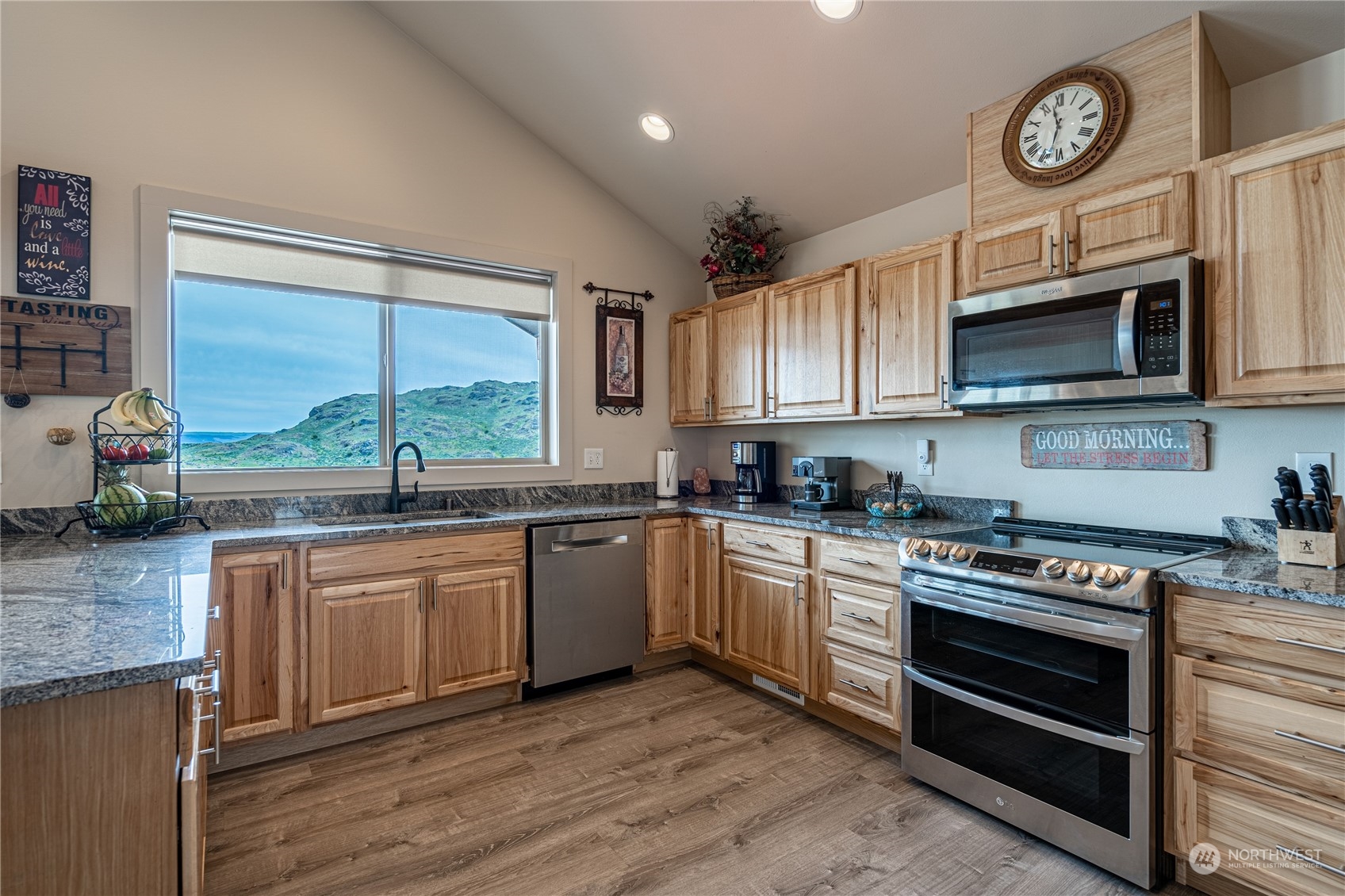 471 A Plata Road Brewster, WA 98812 - Photo 30 of 36 a kitchen with stainless steel appliances granite countertop a stove and a microwave
