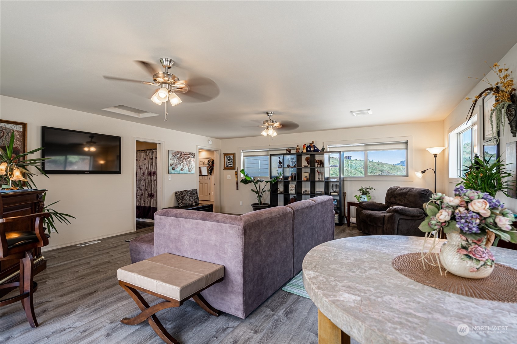471 A Plata Road Brewster, WA 98812 - Photo 33 of 36 a living room with furniture and a flat screen tv