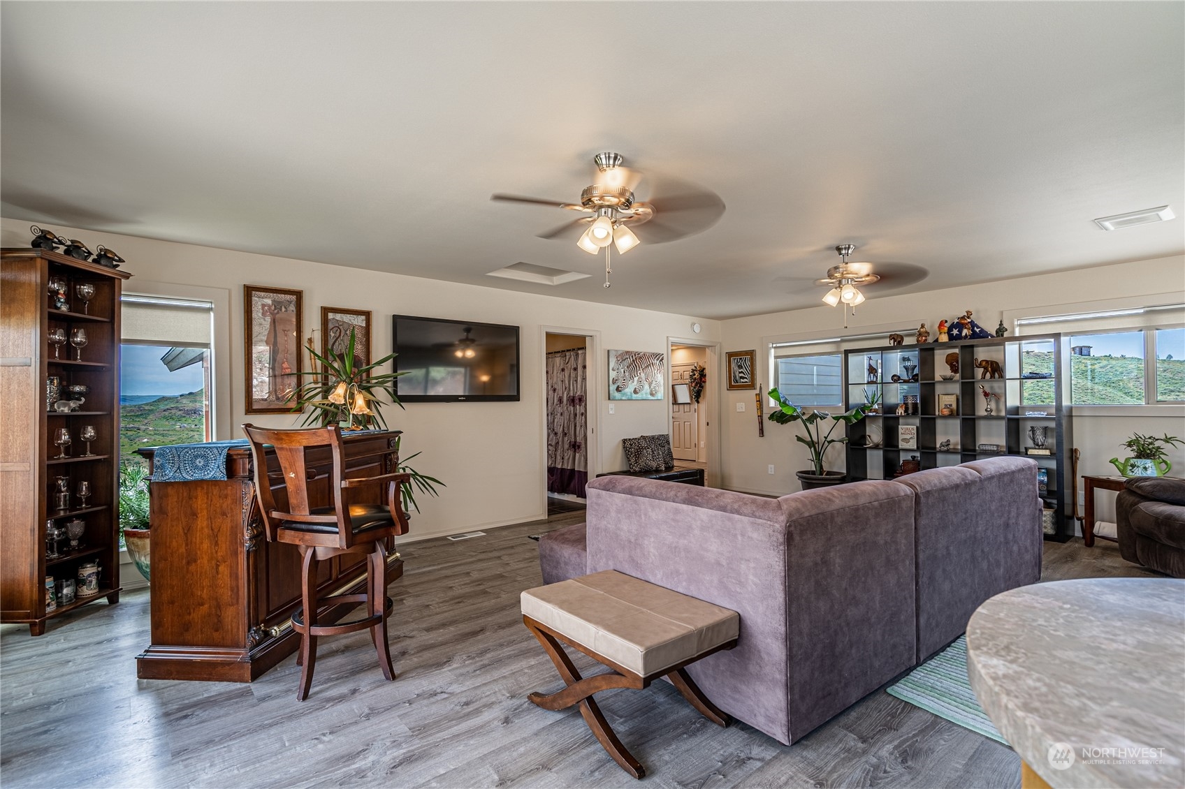 471 A Plata Road Brewster, WA 98812 - Photo 34 of 36 a living room with furniture and a flat screen tv with kitchen view