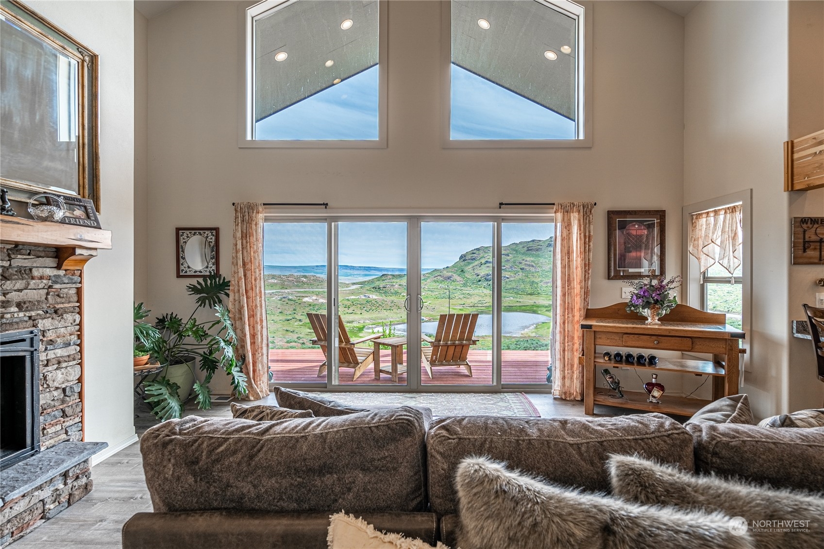 471 A Plata Road Brewster, WA 98812 - Photo 9 of 36 a bedroom with a large bed and a large window