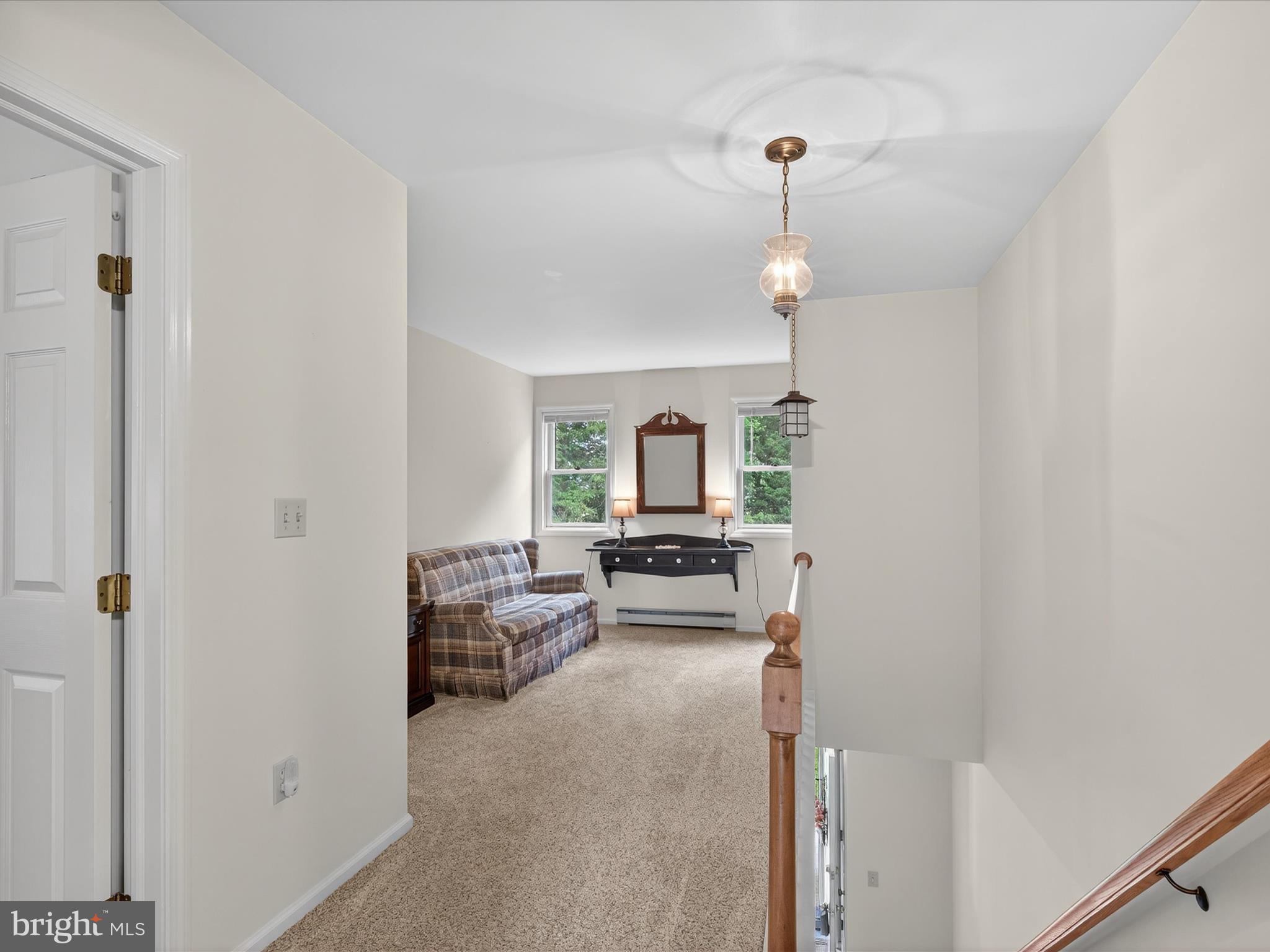 203 Pleasant Hill Drive Lititz, PA 17543 - Photo 17 of 46 a living room with furniture and a chandelier