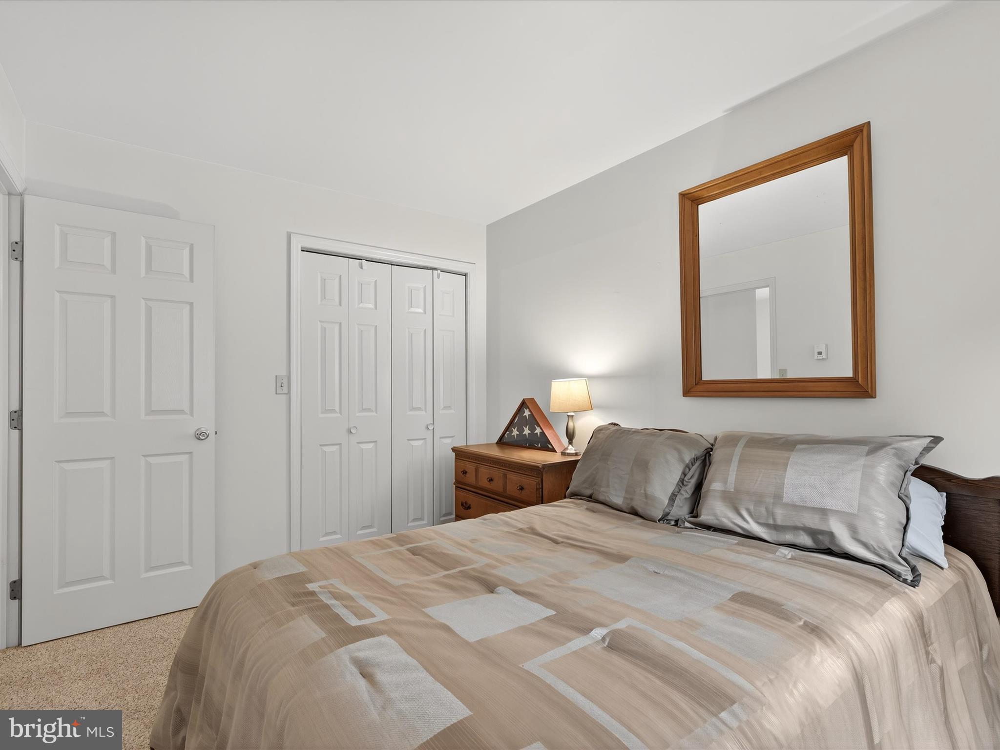 203 Pleasant Hill Drive Lititz, PA 17543 - Photo 25 of 46 a bedroom with a bed and a painting on the wall