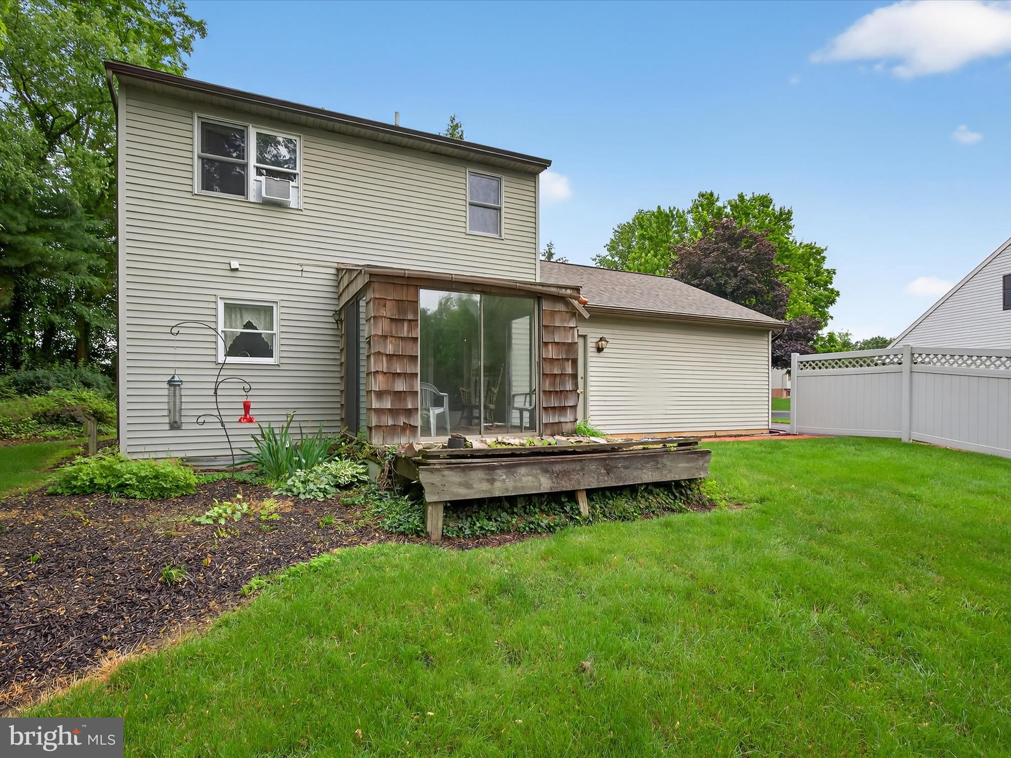 203 Pleasant Hill Drive Lititz, PA 17543 - Photo 30 of 46 a backyard of a house with wooden deck and barbeque oven