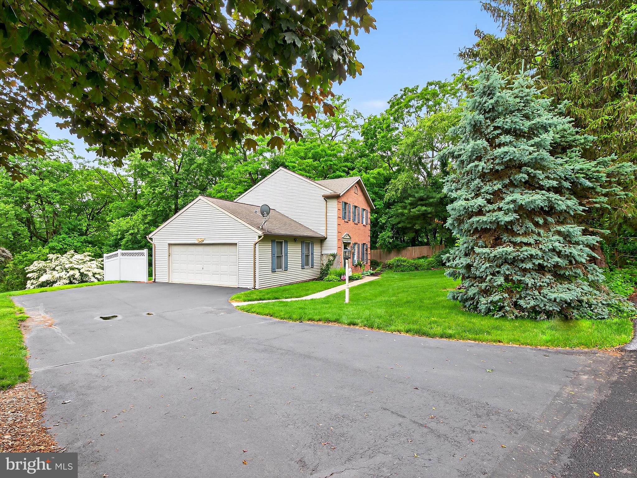 203 Pleasant Hill Drive Lititz, PA 17543 - Photo 4 of 46 a view of a house with a small yard and large tree