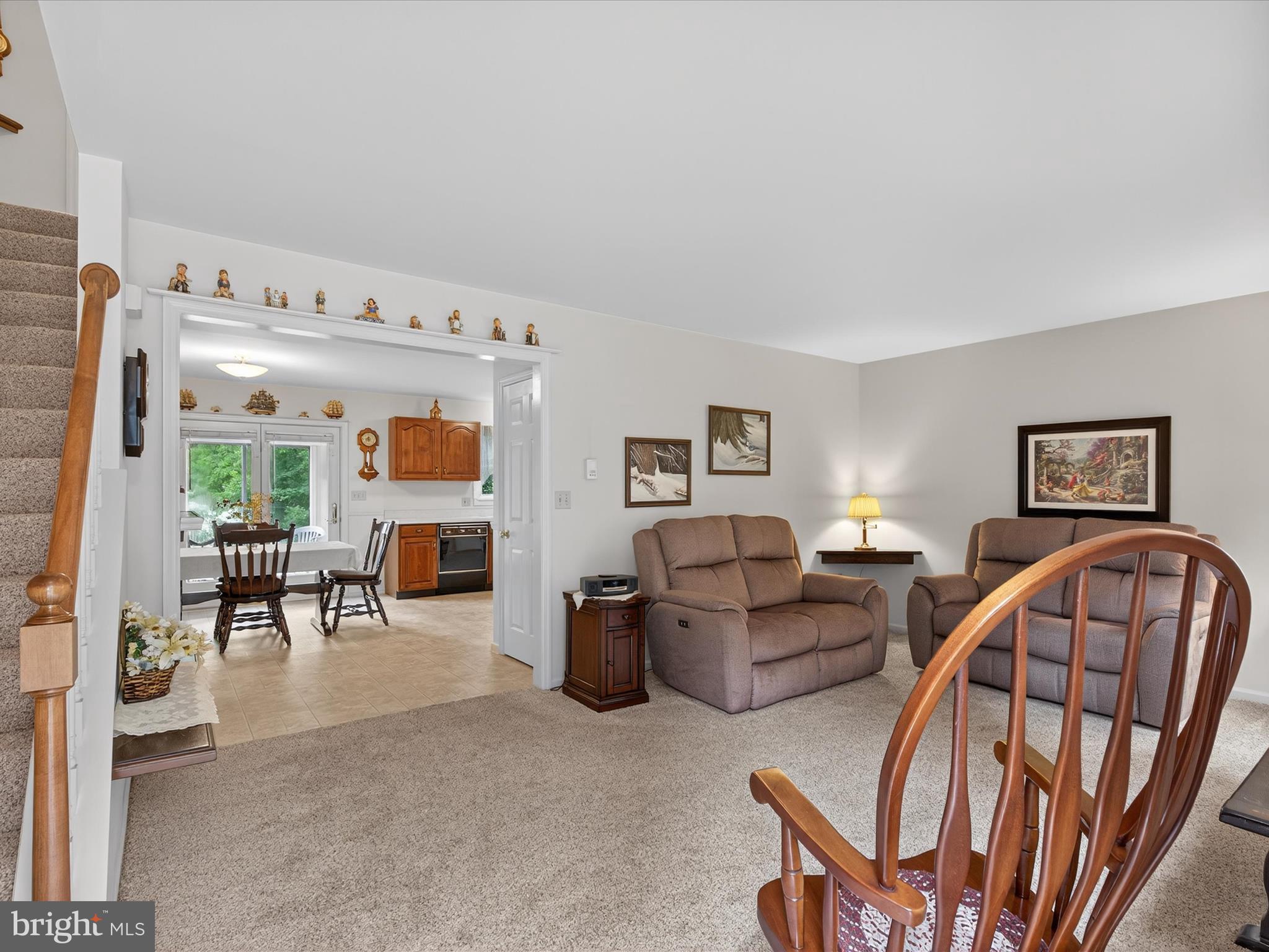 203 Pleasant Hill Drive Lititz, PA 17543 - Photo 8 of 46 a living room with furniture and a dining table with chairs