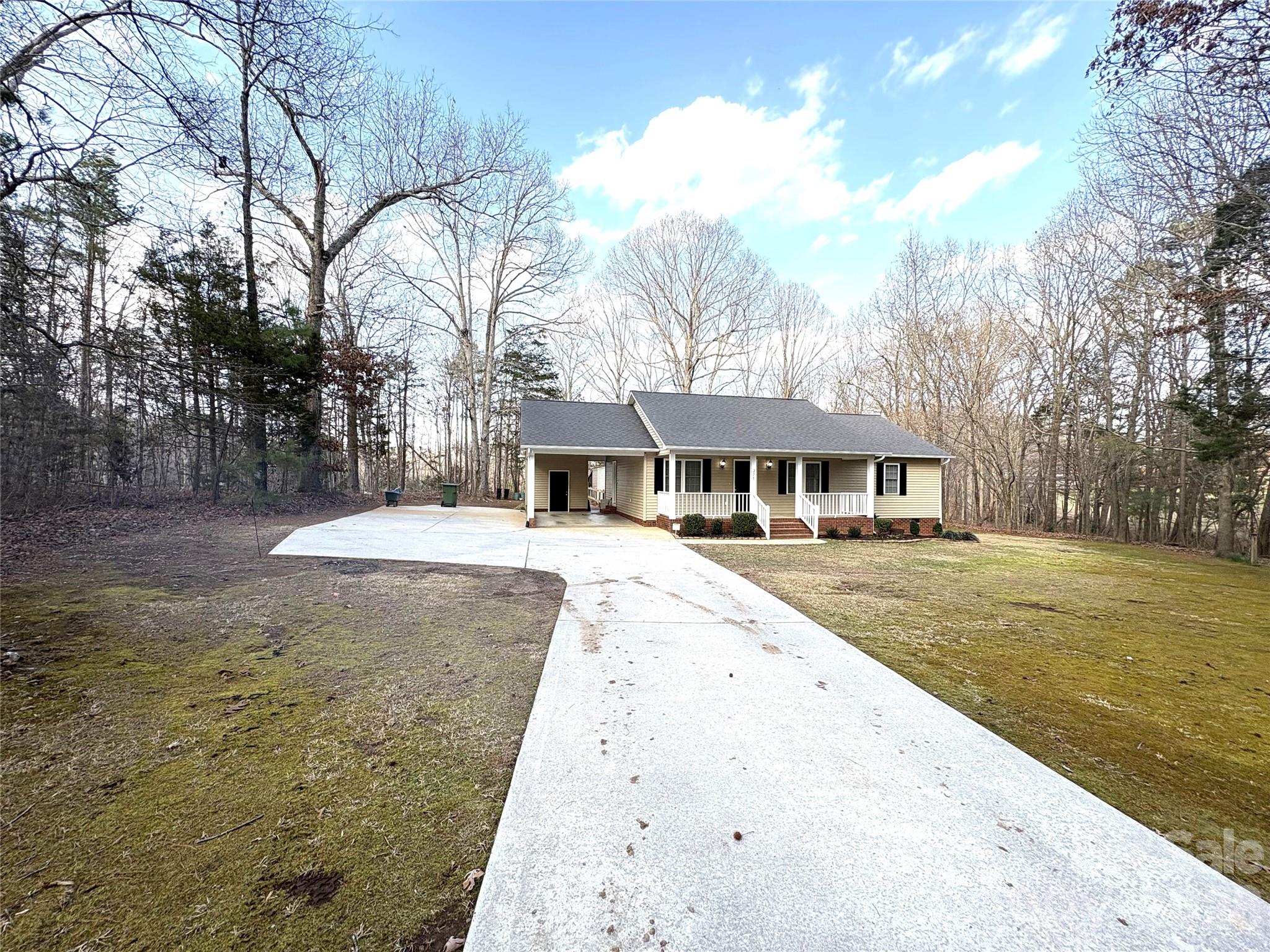 275 Holiday Road Lancaster, SC 29720 - Photo 2 of 8 a front view of a house with a yard