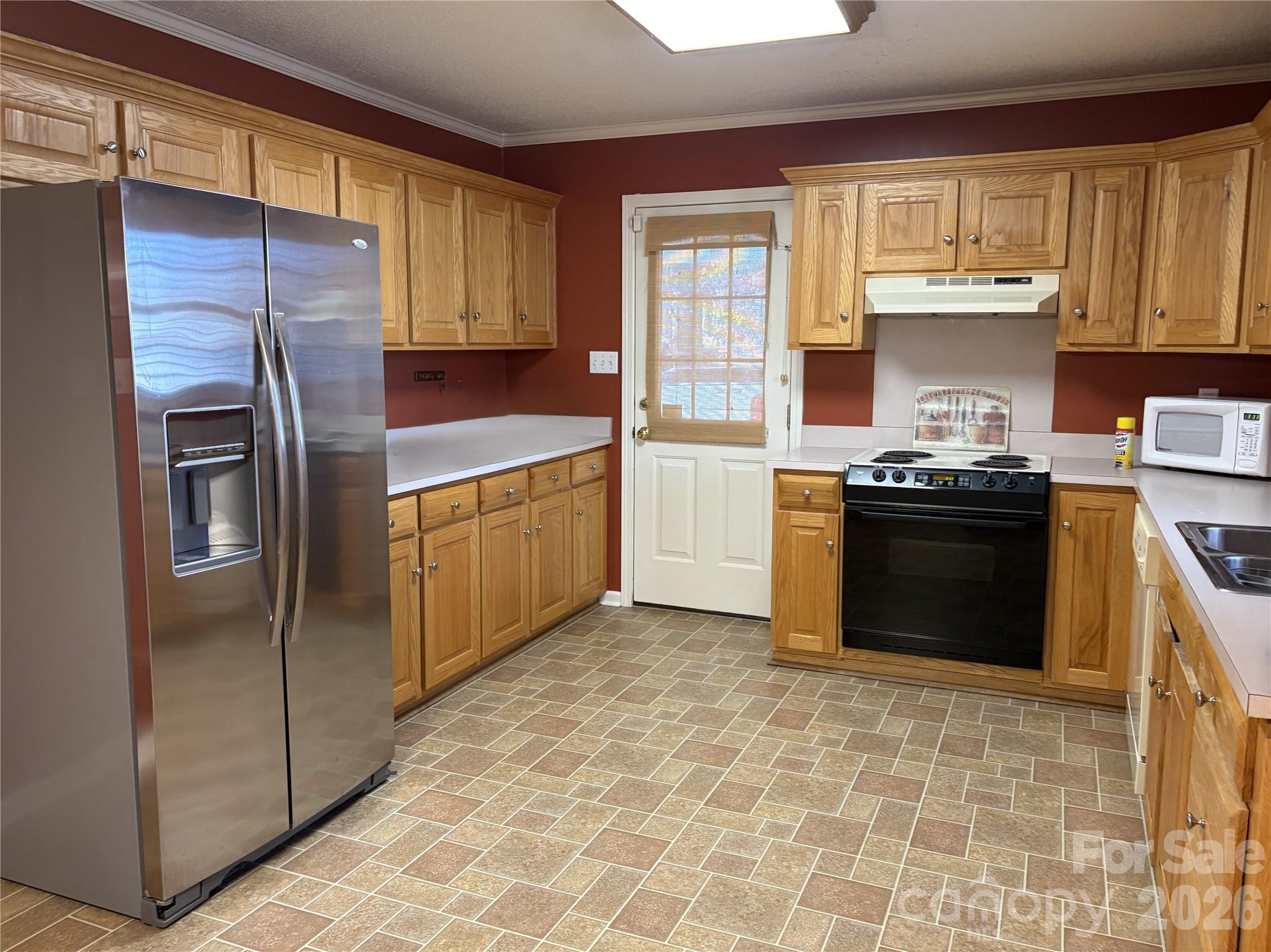 275 Holiday Road Lancaster, SC 29720 - Photo 4 of 8 a kitchen with stainless steel appliances granite countertop a stove a sink and a refrigerator