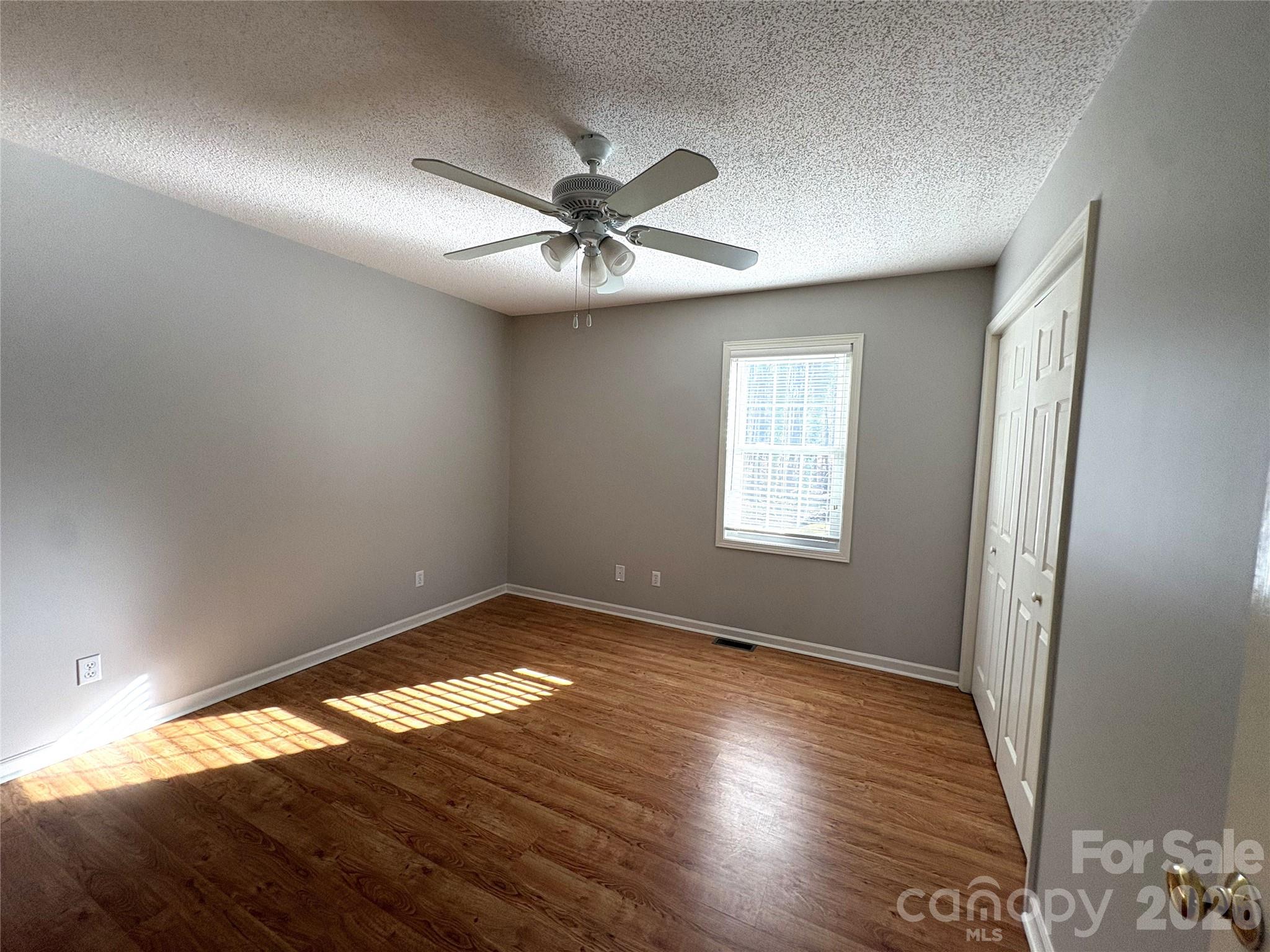 275 Holiday Road Lancaster, SC 29720 - Photo 7 of 8 a view of empty room with wooden floor and fan