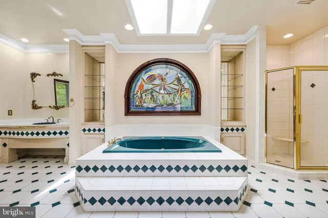 a bathroom with a tub sink and vanity