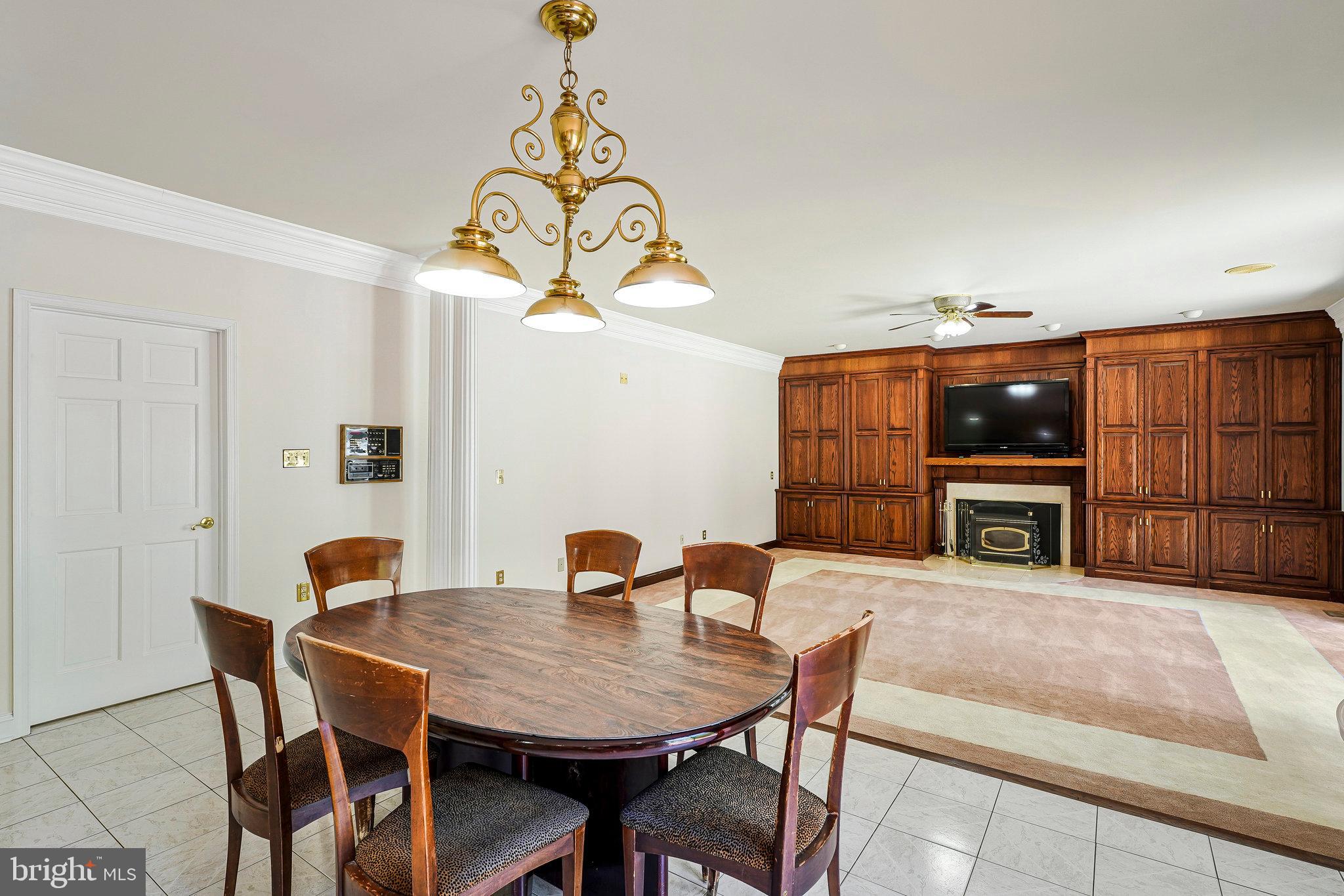 8652 Tuttle Road Springfield, VA 22152 - Photo 25 of 102 a view of a dining room with furniture and chandelier