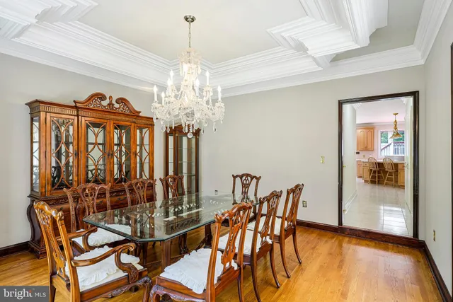 a view of a room with wooden floor and fan