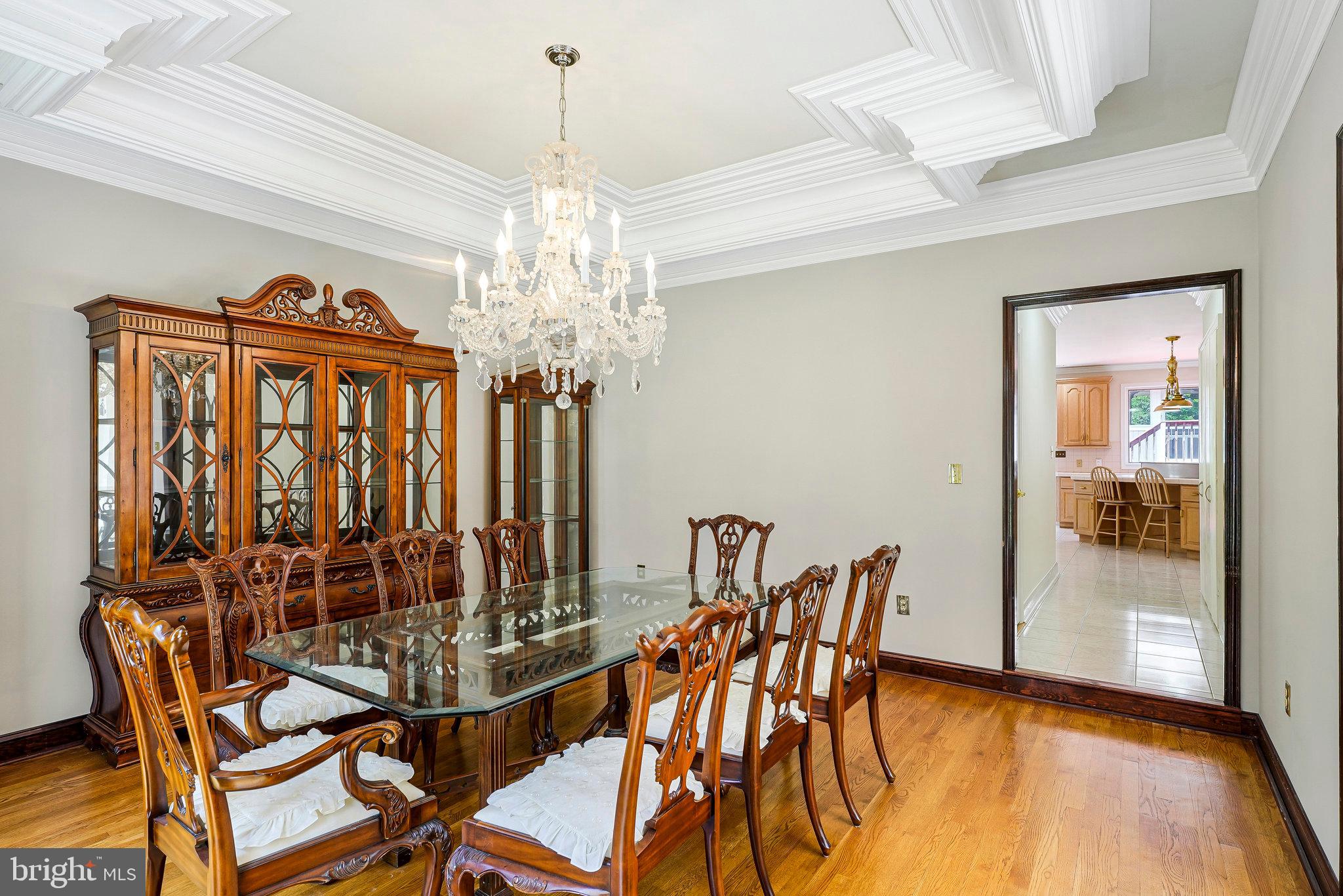 8652 Tuttle Road Springfield, VA 22152 - Photo 30 of 102 a view of a dining room with furniture wooden floor and chandelier