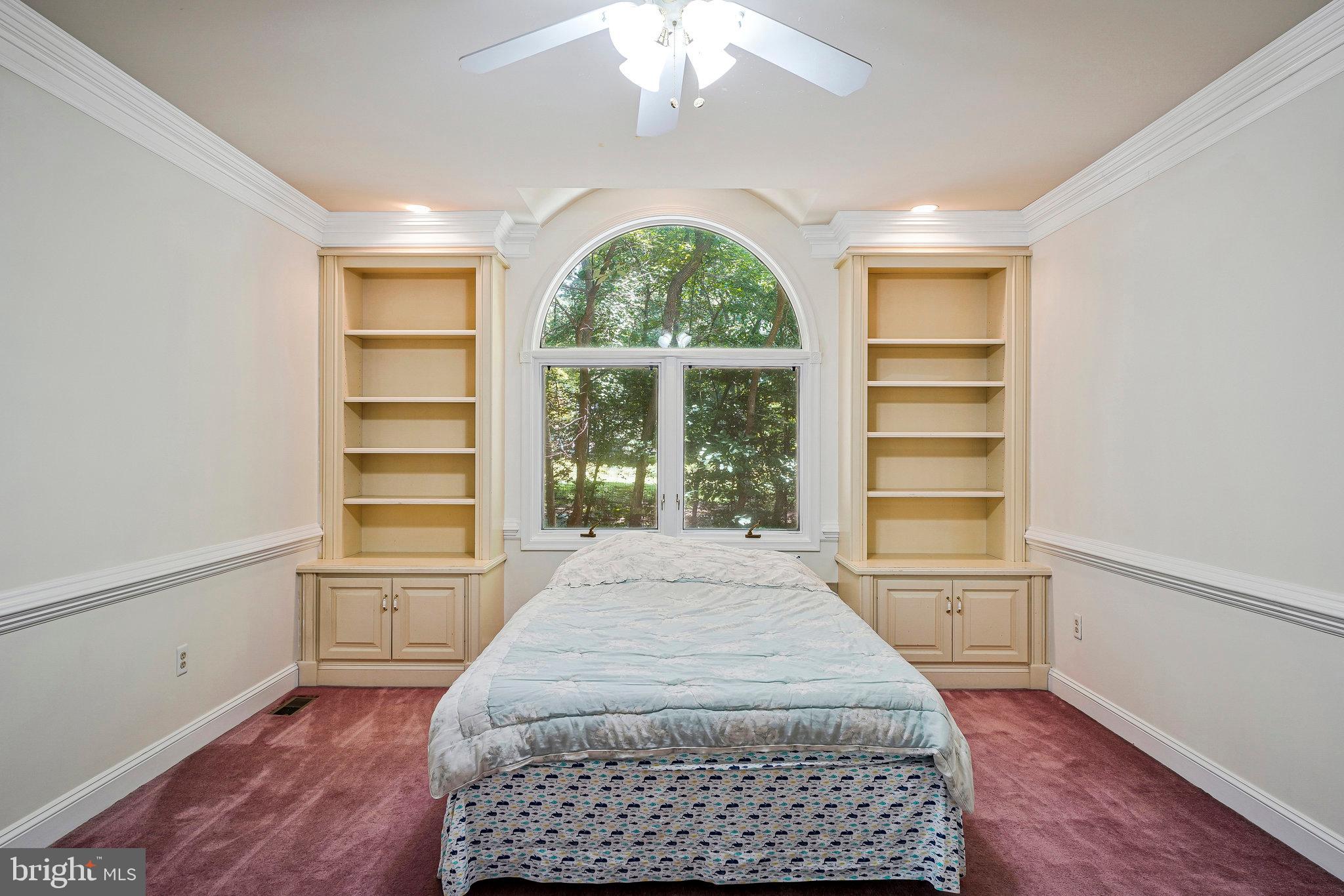 8652 Tuttle Road Springfield, VA 22152 - Photo 35 of 102 a spacious bedroom with a bed and a window