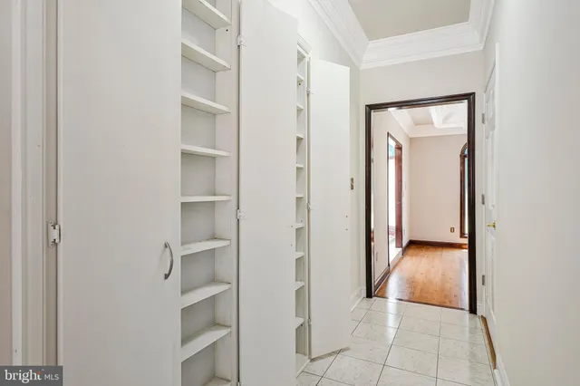 a front view of a house with a garden and plants